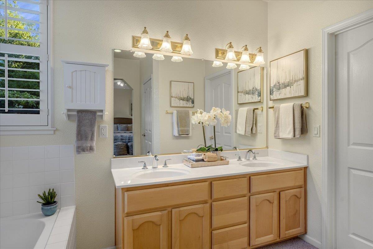 201 Augusta Lane Aptos, CA 95003 - Photo 14 of 36 a bathroom with a sink double vanity and a mirror