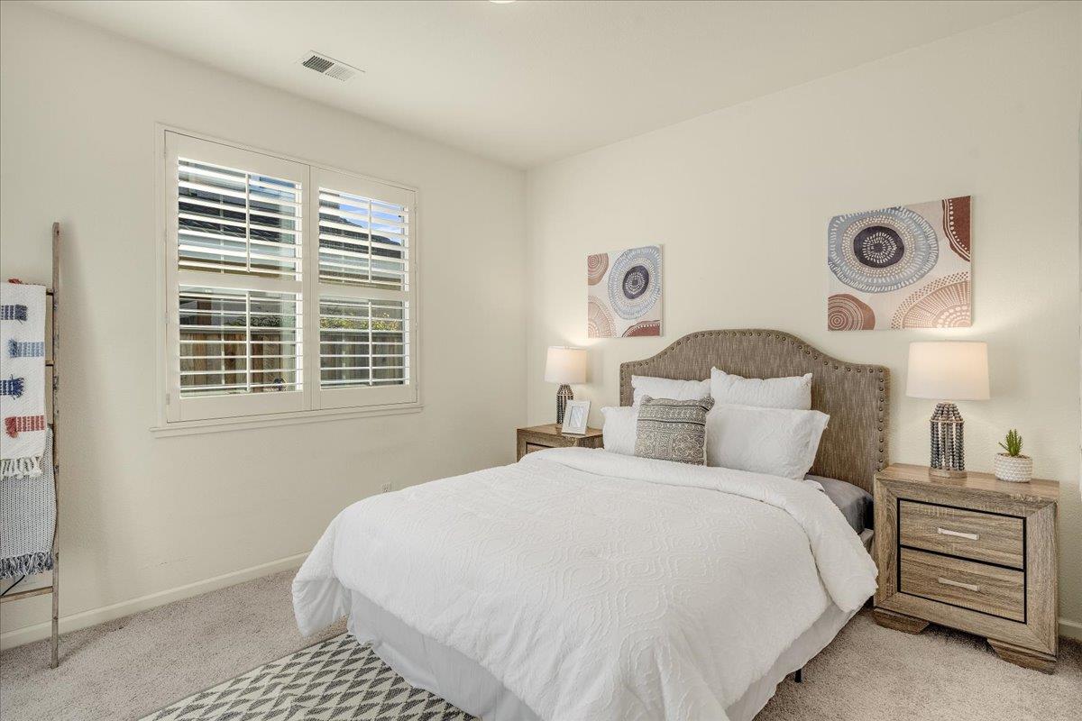 201 Augusta Lane Aptos, CA 95003 - Photo 18 of 36 a bedroom with a bed and a window