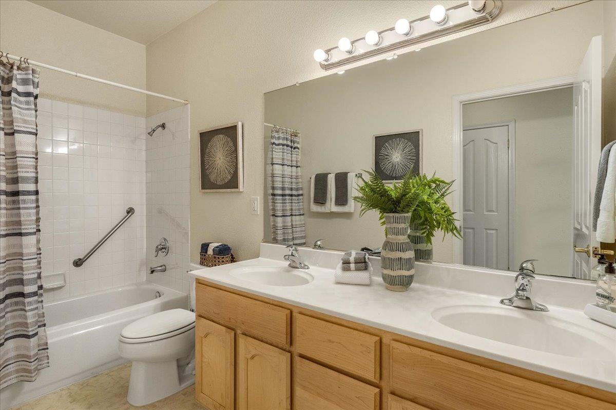 201 Augusta Lane Aptos, CA 95003 - Photo 19 of 36 a bathroom with a double vanity sink toilet and shower