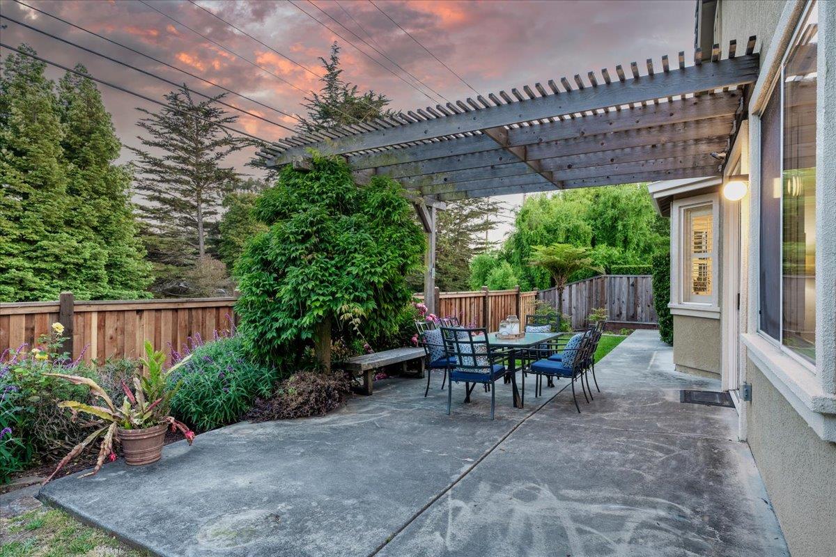 201 Augusta Lane Aptos, CA 95003 - Photo 28 of 36 a view of a patio with table and chairs potted plants with wooden floor and fence