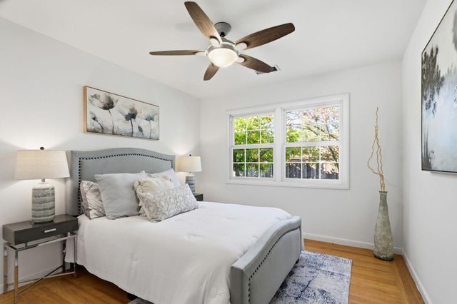 a bedroom with a large bed and a window