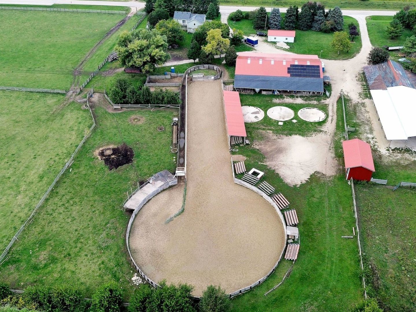 16989 East Ritchie Road Rochelle, IL 61068 - Photo 5 of 81 an aerial view of a house with outdoor space and tennis court