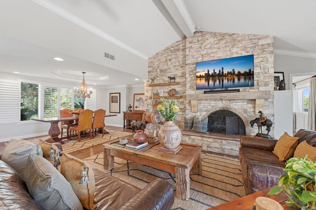 560 Rancho Camino Fallbrook, CA 92028 - Photo 11 of 70 a living room with furniture a fireplace and a large window
