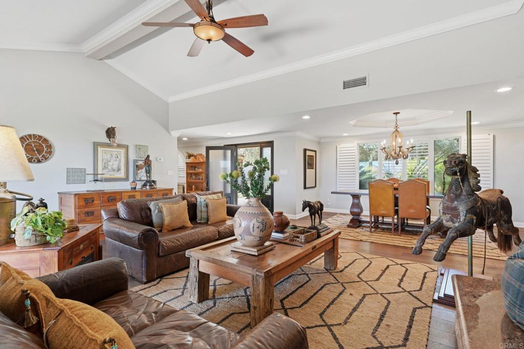 560 Rancho Camino Fallbrook, CA 92028 - Photo 12 of 70 a living room with furniture ceiling fan and a rug