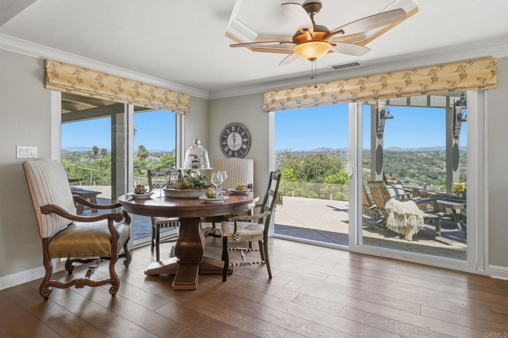 560 Rancho Camino Fallbrook, CA 92028 - Photo 16 of 70 a view of a dining room with furniture window and wooden floor