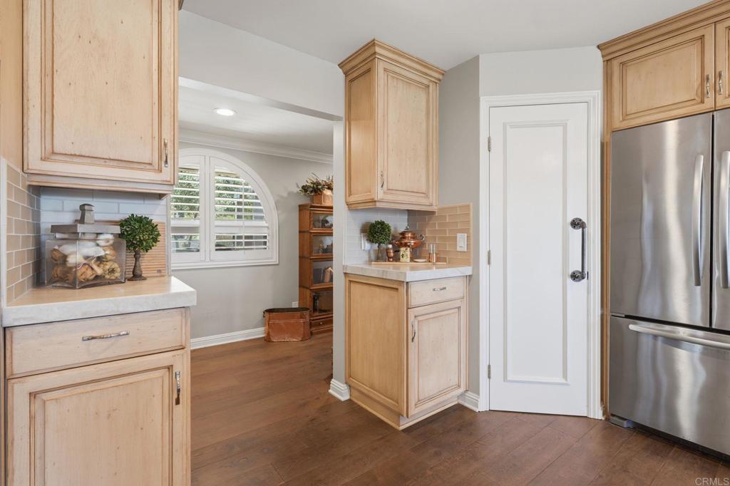 560 Rancho Camino Fallbrook, CA 92028 - Photo 20 of 70 a kitchen with white cabinets and refrigerator