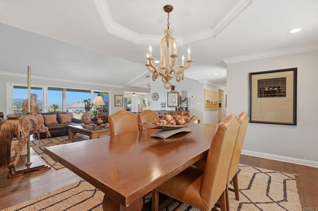 560 Rancho Camino Fallbrook, CA 92028 - Photo 22 of 70 a view of a dining room with furniture and chandelier