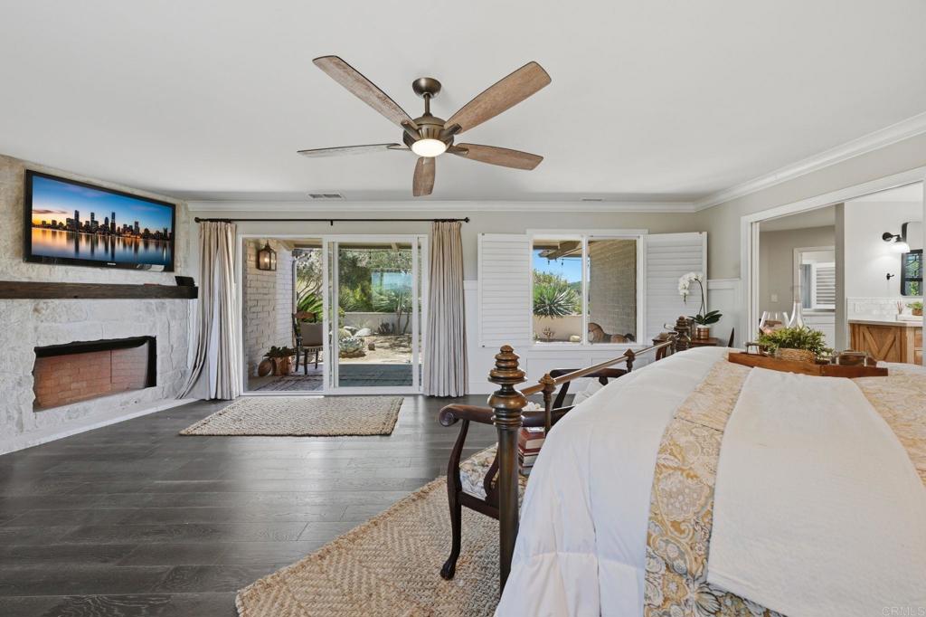 560 Rancho Camino Fallbrook, CA 92028 - Photo 26 of 70 a bed room with a bed and a fireplace