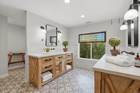 a bedroom with a bed dresser and a window