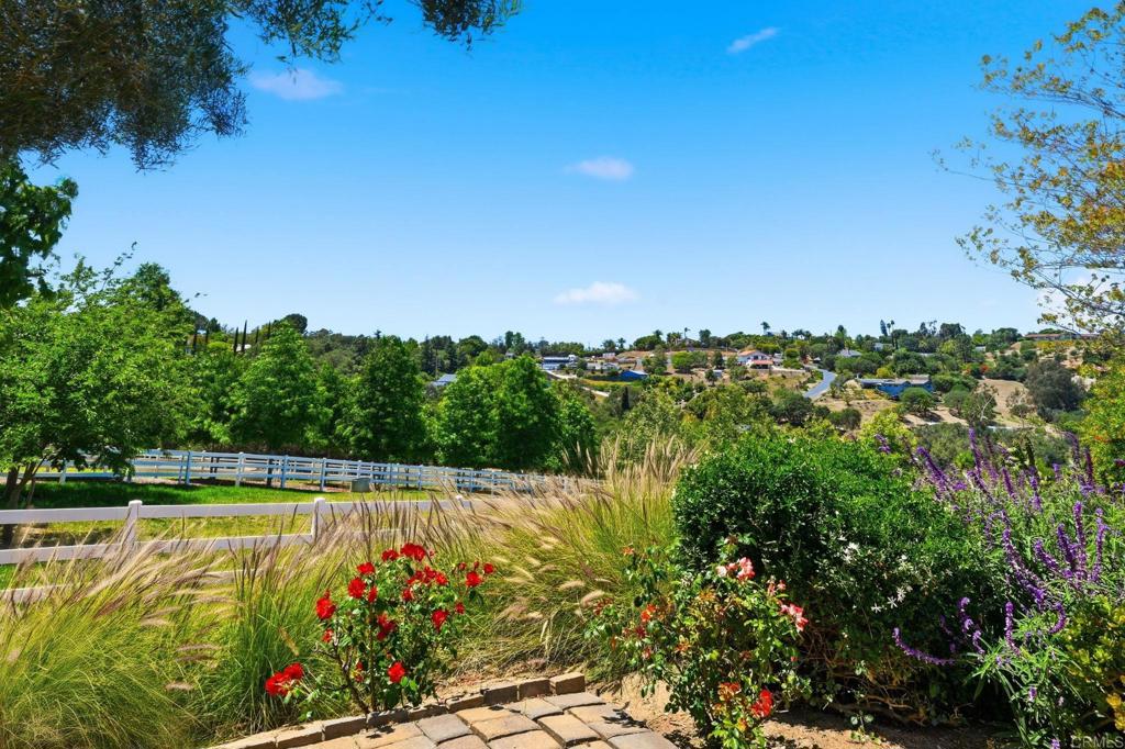 560 Rancho Camino Fallbrook, CA 92028 - Photo 58 of 70 a view of a swimming pool with an outdoor seating area and trees around