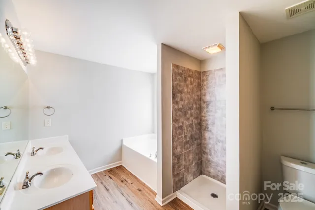 a bathroom with a bathtub and shower