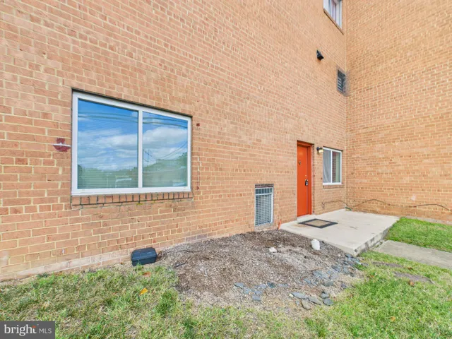 a view of a backyard with sitting area