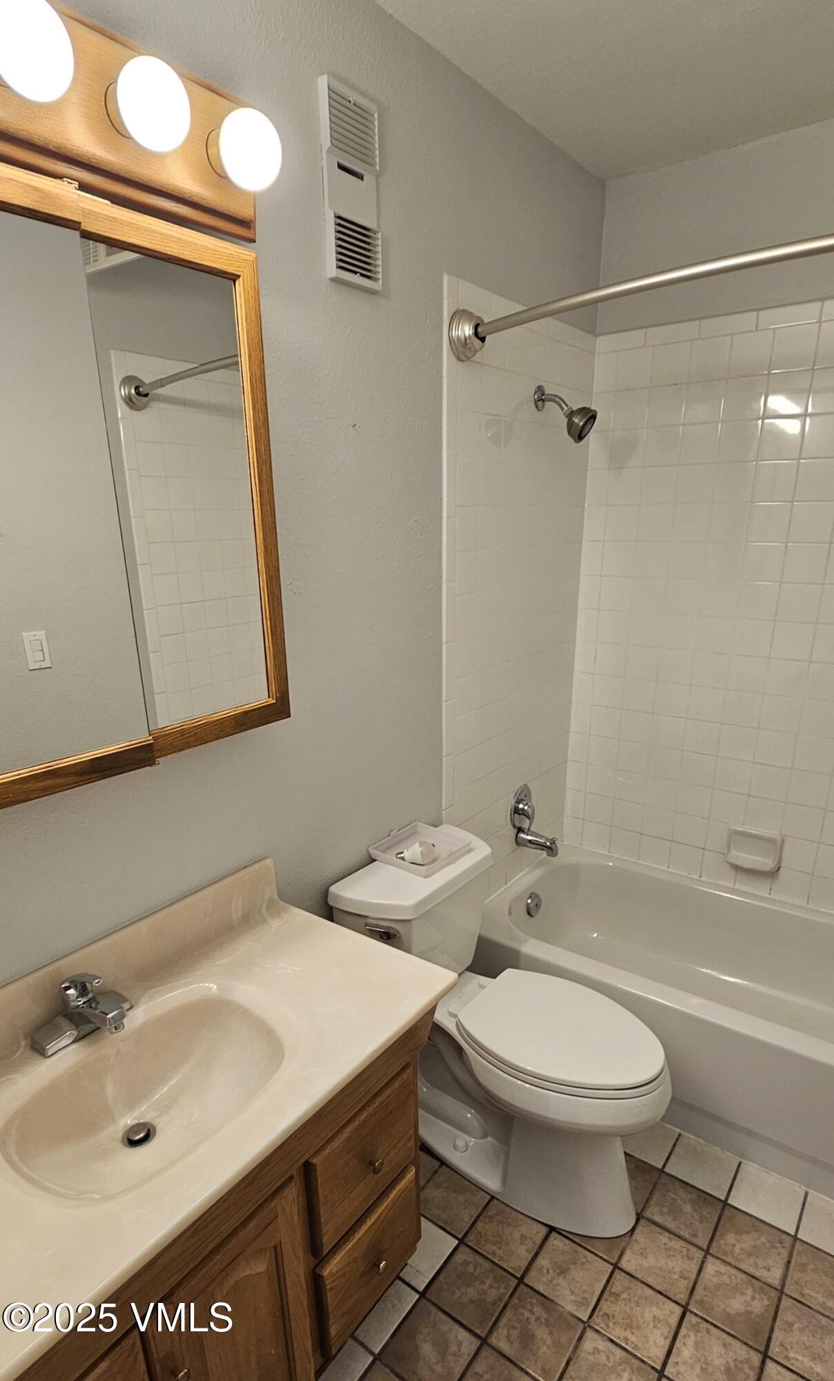165 Gopher Road, Unit 25 Avon, CO 81620 - Photo 11 of 17 a bathroom with a sink a toilet and shower