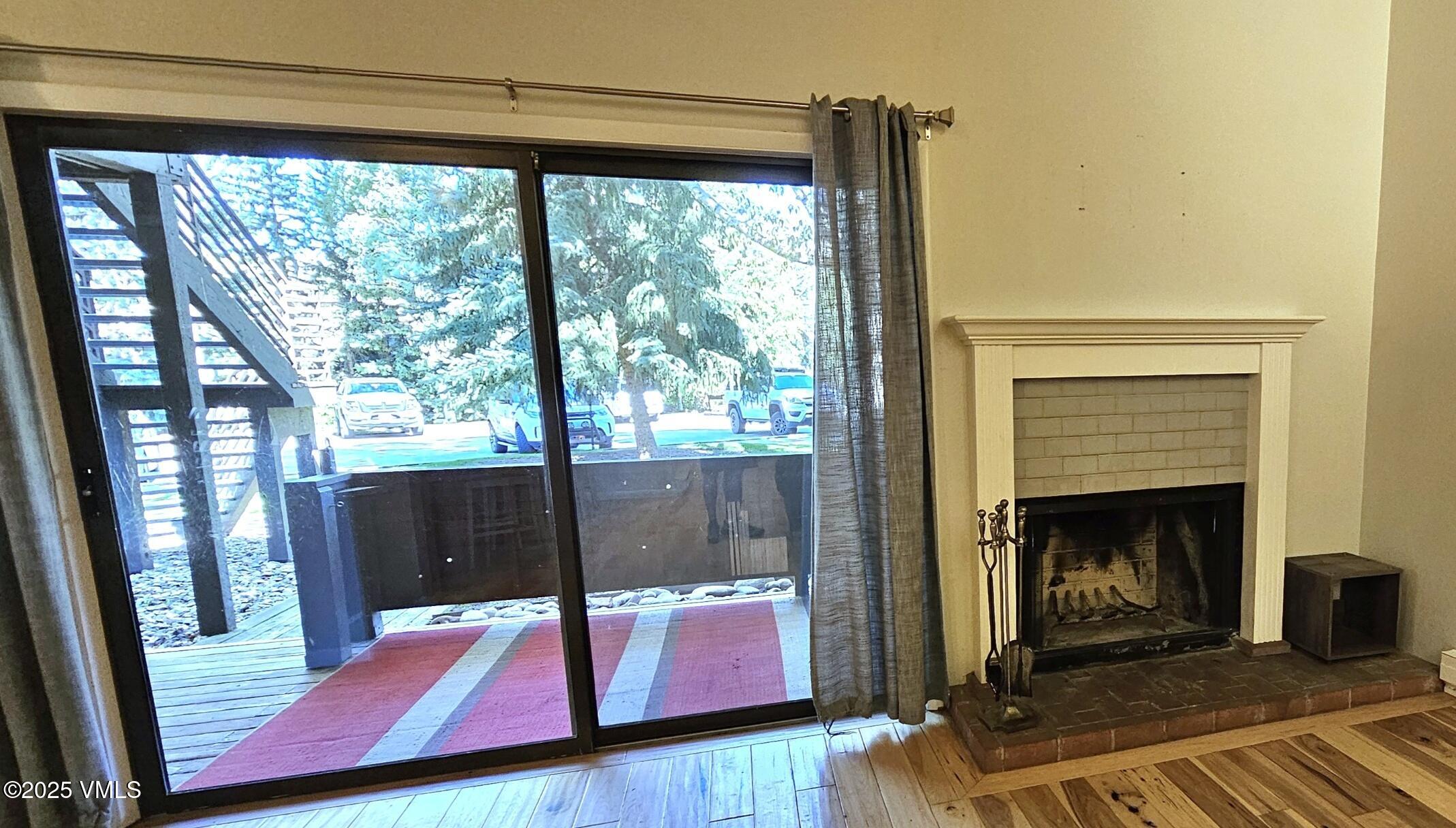 165 Gopher Road, Unit 25 Avon, CO 81620 - Photo 4 of 17 a living room with furniture and a fireplace