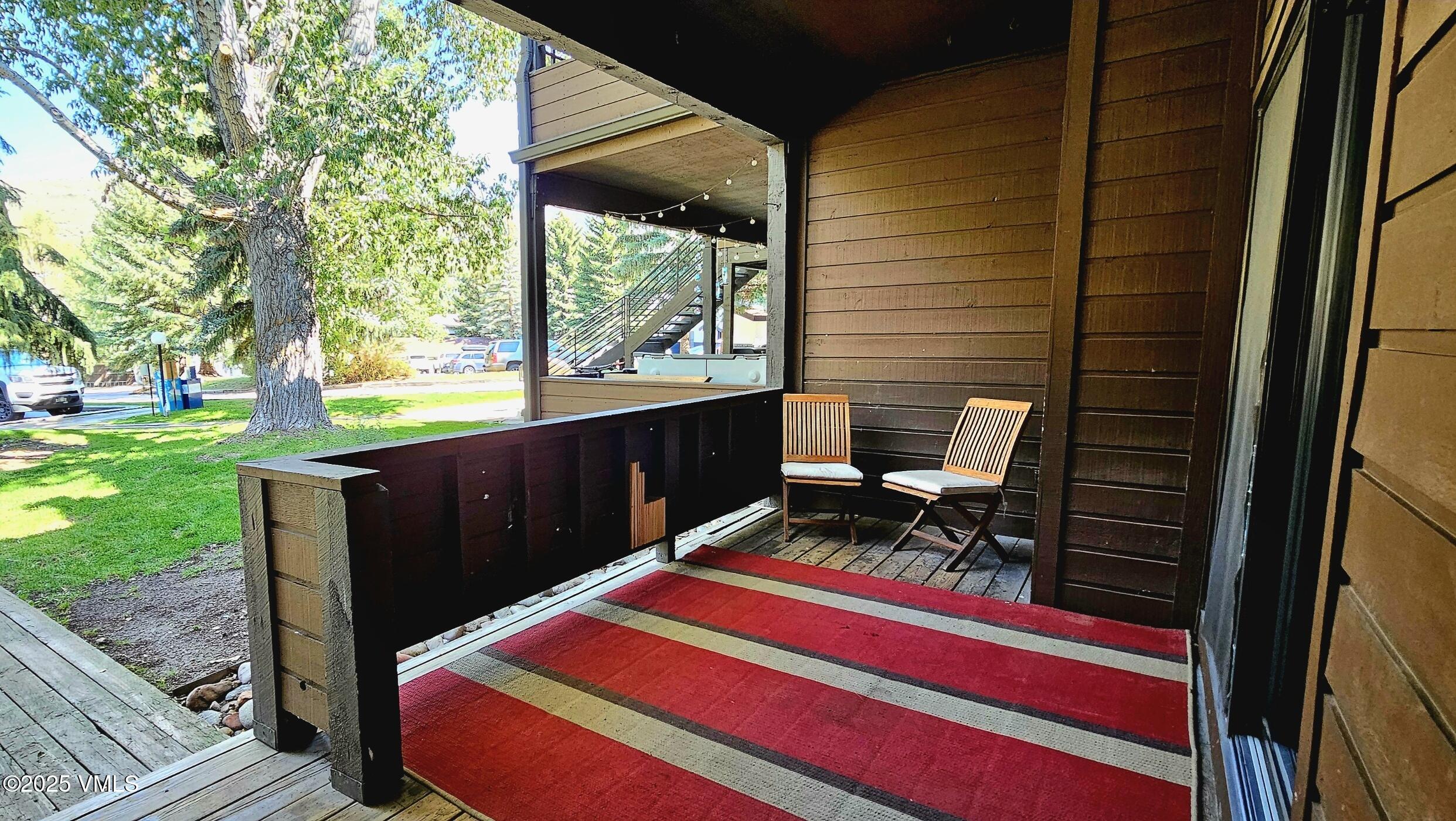 165 Gopher Road, Unit 25 Avon, CO 81620 - Photo 8 of 17 a backyard view of a house with a garden and barbeque oven