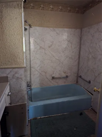 a bathroom with a bathtub