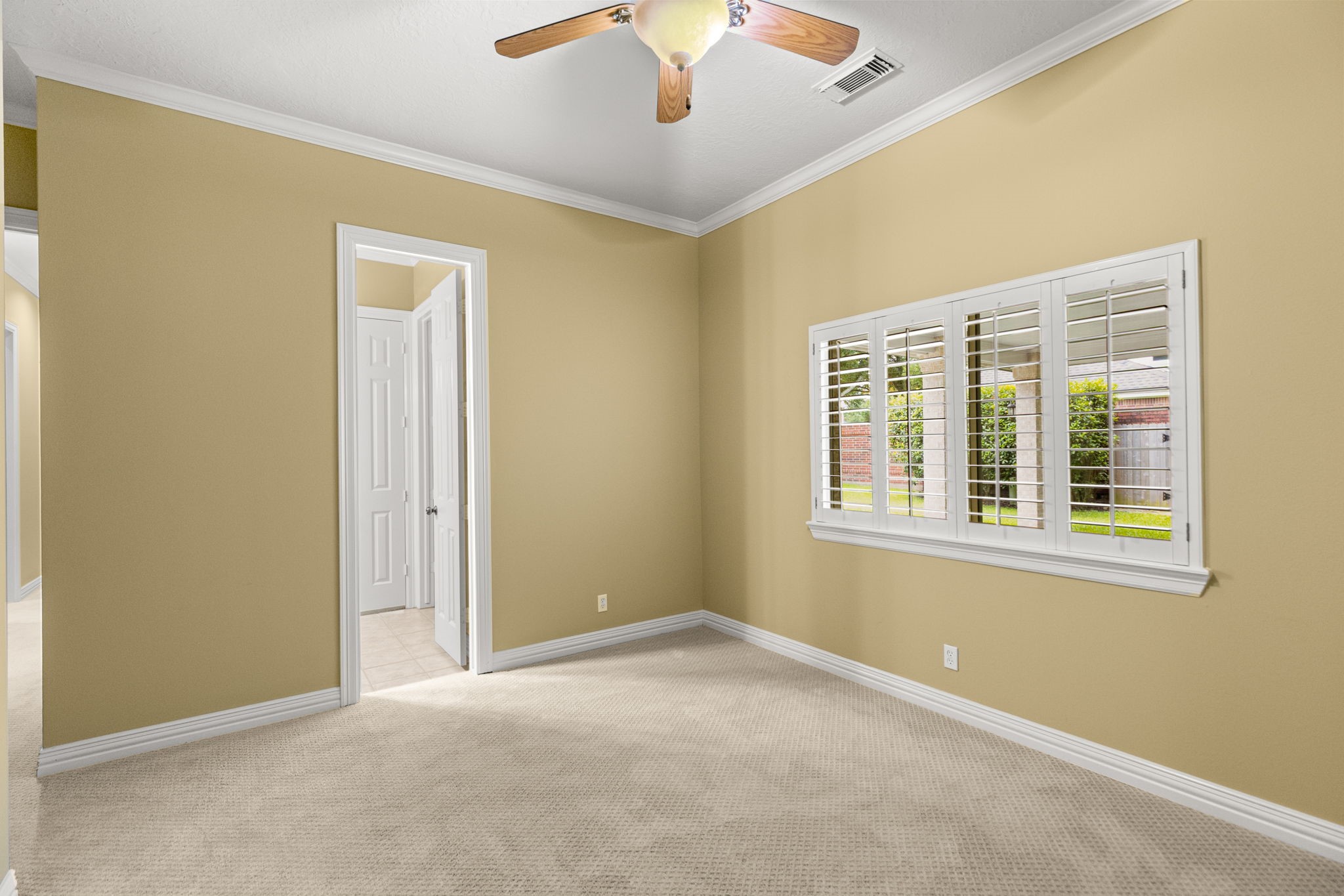 6610 Radley Drive Spring, TX 77379 - Photo 33 of 50 4th guest bedroom w/ view of side yard at porte-cochere