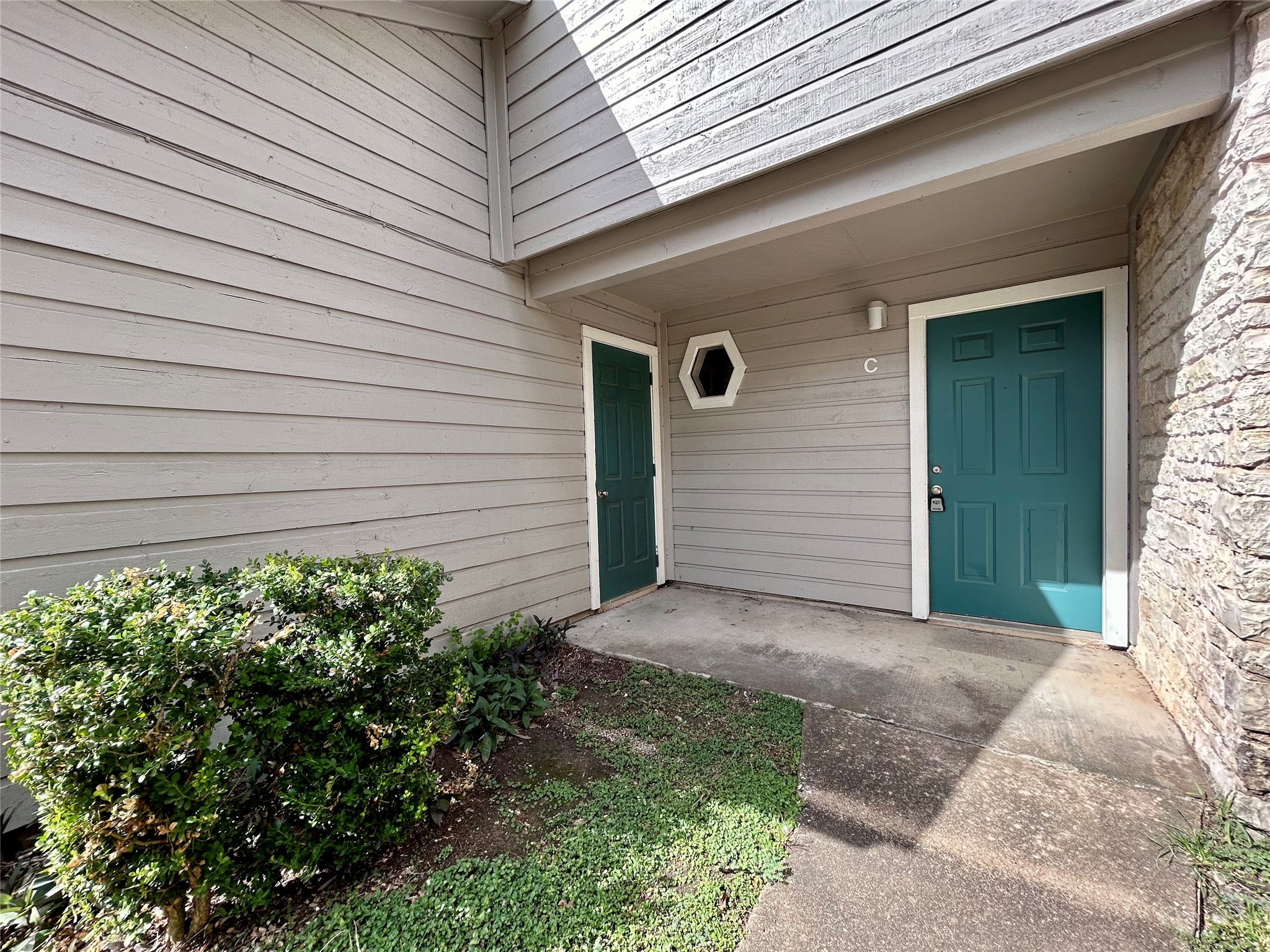8905 Schick Road, Unit C Austin, TX 78729 - Photo 1 of 1 a front view of a house with garden