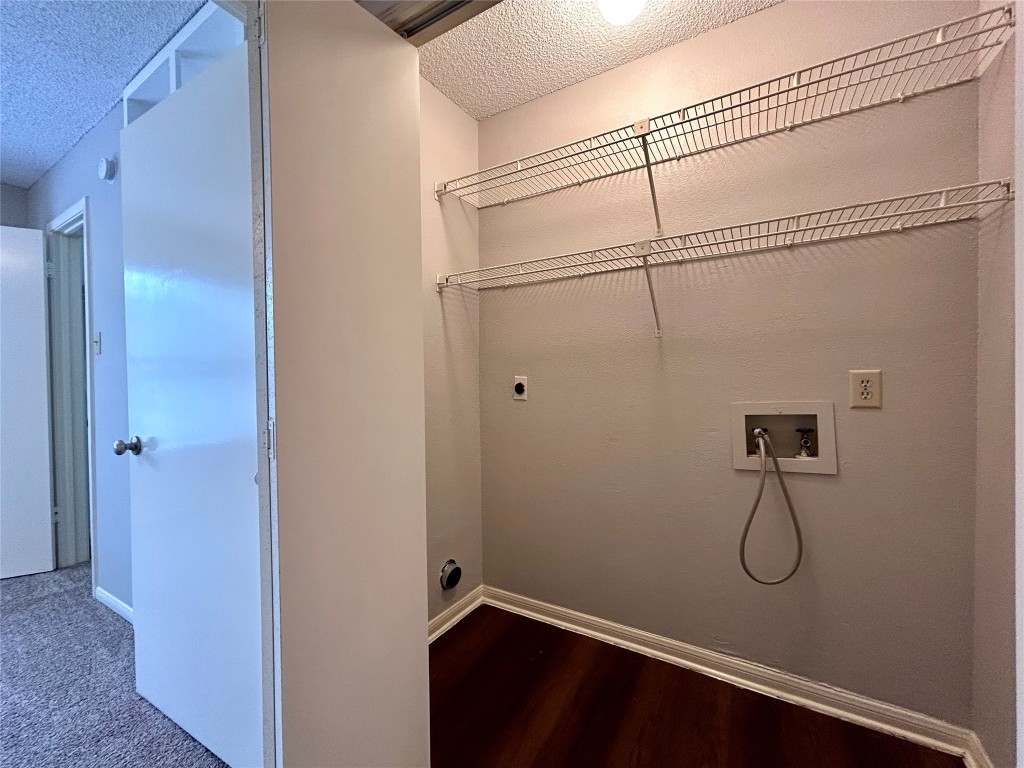 8905 Schick Road, Unit C Austin, TX 78729 - Photo 17 of 25 a bathroom with a glass shower door
