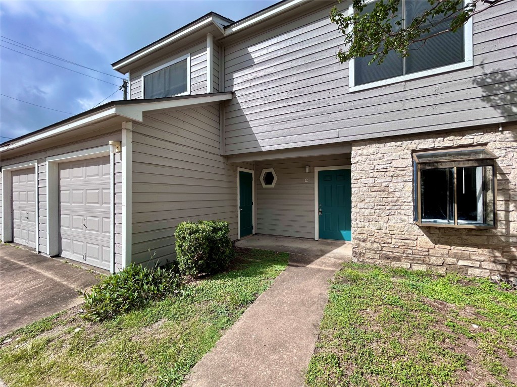 8905 Schick Road, Unit C Austin, TX 78729 - Photo 24 of 25 a front view of a house with garden