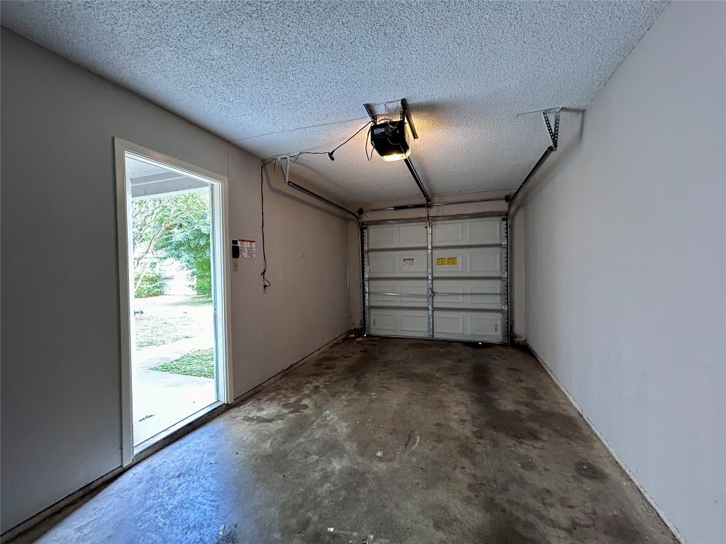8905 Schick Road, Unit C Austin, TX 78729 - Photo 25 of 25 an empty room with windows and ceiling fan
