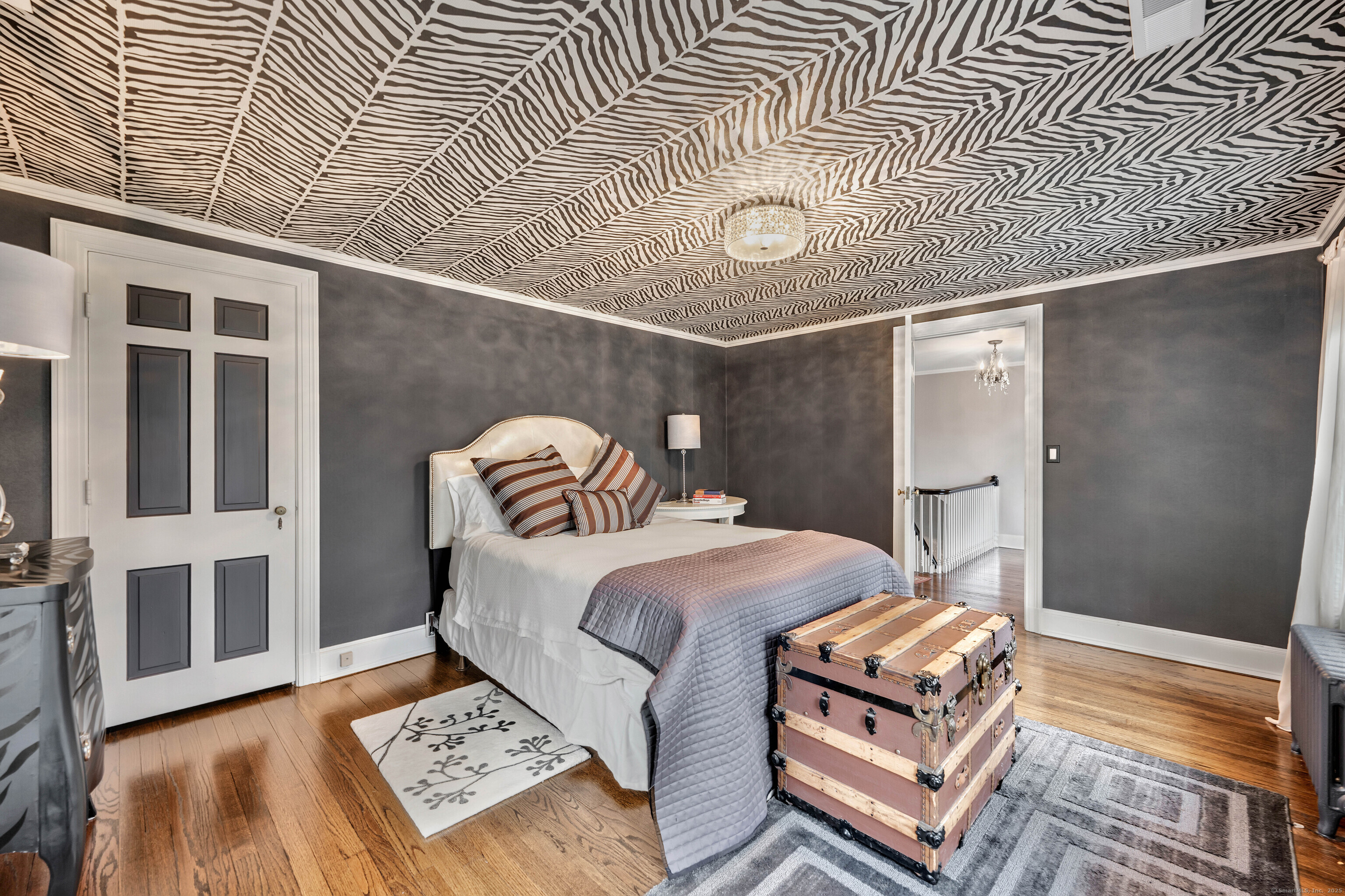 77 Eastfield Road Waterbury, CT 06708 - Photo 13 of 40 a bedroom with a bed and a lamp on dresser