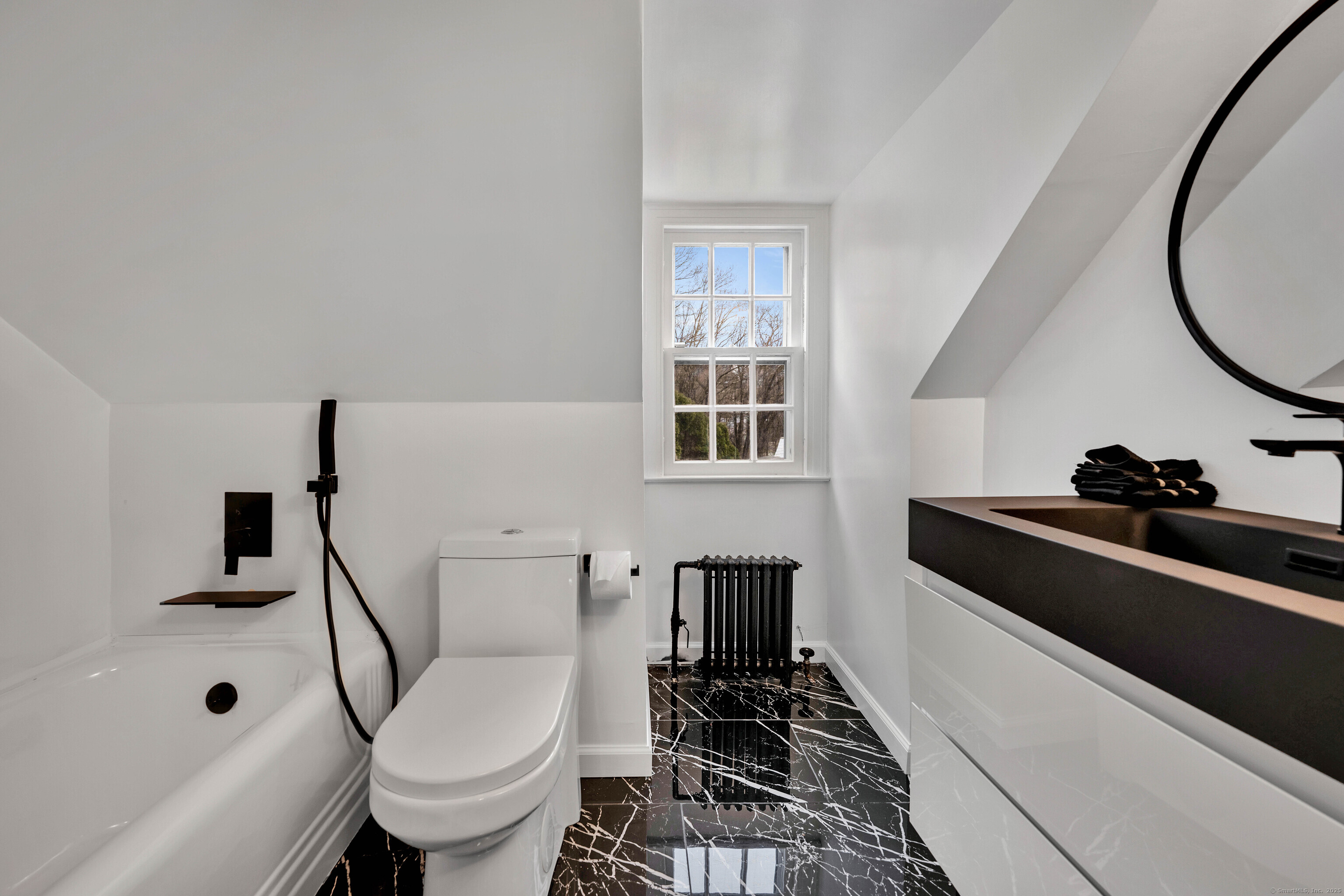 77 Eastfield Road Waterbury, CT 06708 - Photo 15 of 40 a bathroom with a sink a toilet and a bathtub