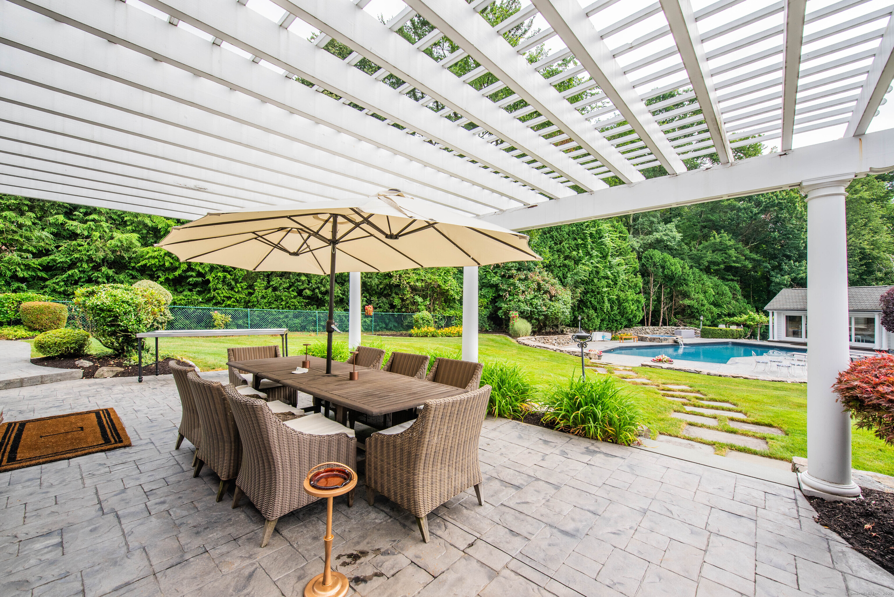 77 Eastfield Road Waterbury, CT 06708 - Photo 18 of 40 a view of a patio with a table chairs and a backyard