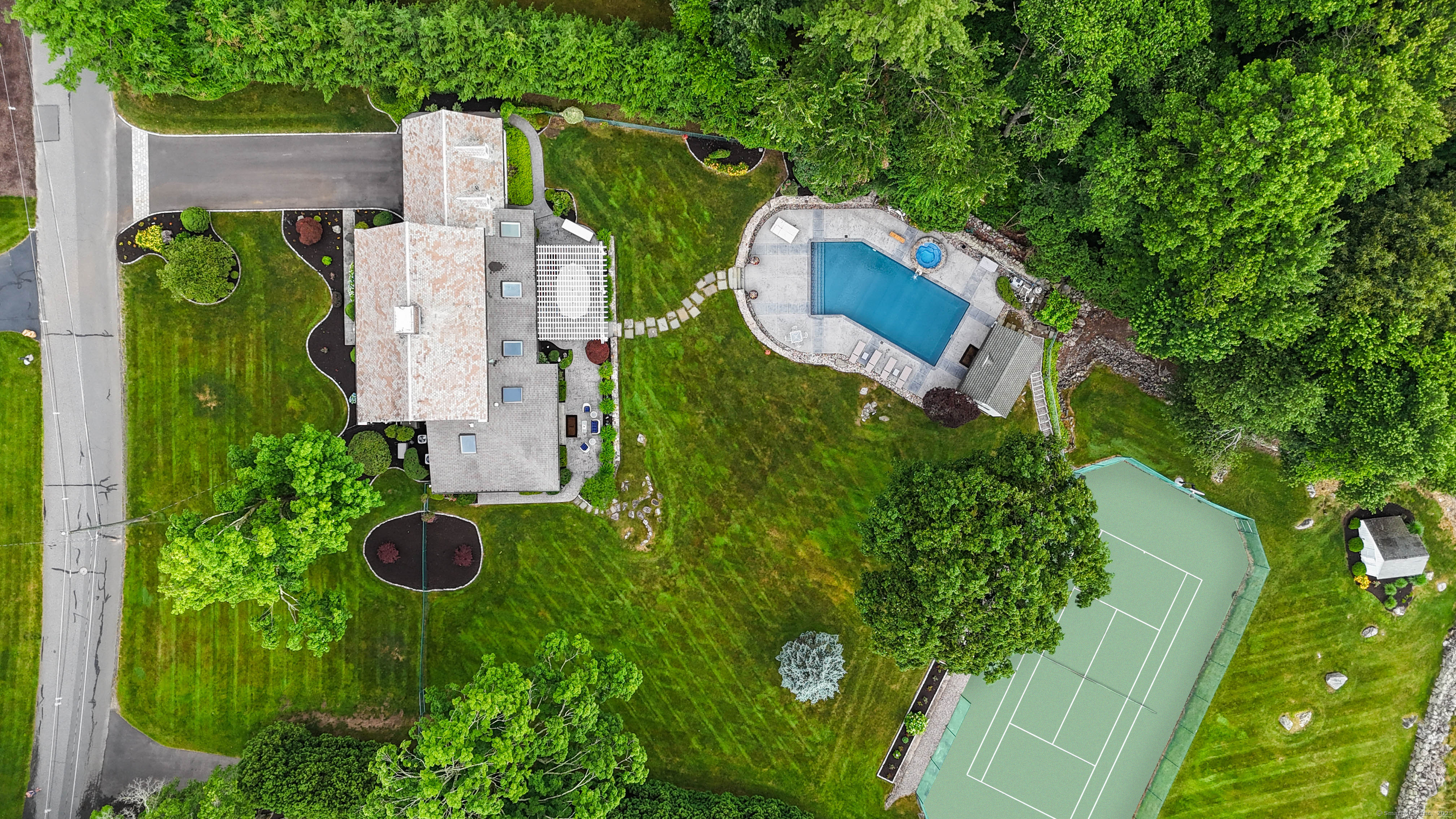 77 Eastfield Road Waterbury, CT 06708 - Photo 23 of 40 an aerial view of a house with swimming pool and garden view