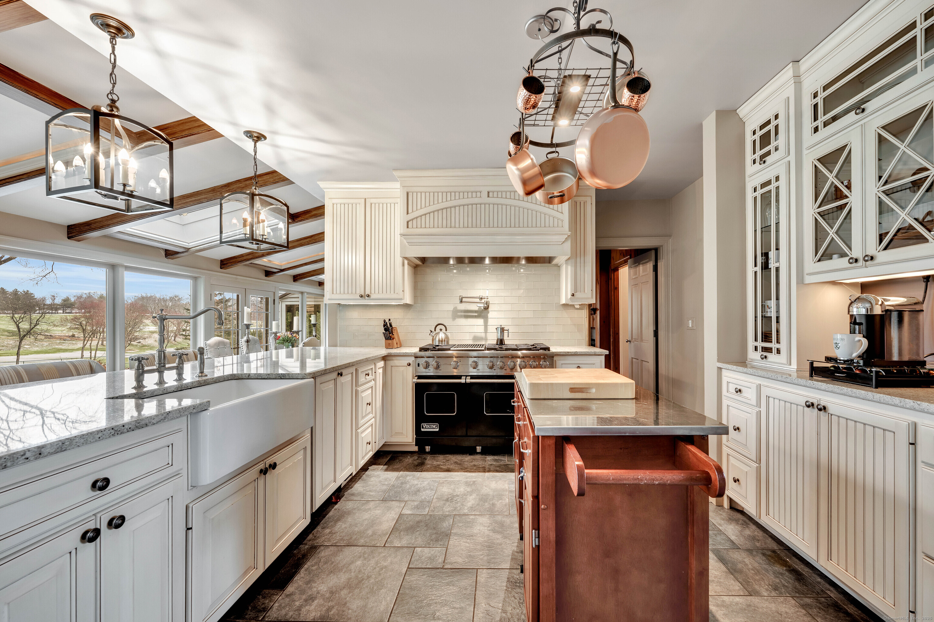 77 Eastfield Road Waterbury, CT 06708 - Photo 34 of 40 a kitchen with cabinets and chandelier