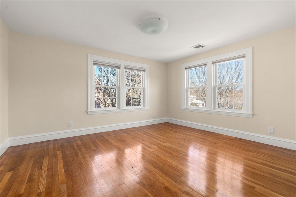 25 Allen Avenue Newton, MA 02468 - Photo 12 of 19 a view of an empty room with window and wooden floor