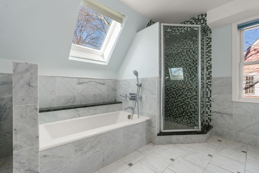 25 Allen Avenue Newton, MA 02468 - Photo 15 of 19 a bathroom with a bathtub and shower