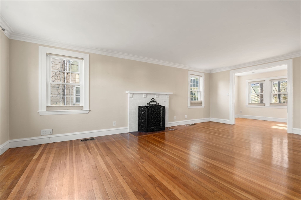 25 Allen Avenue Newton, MA 02468 - Photo 10 of 19 a view of an empty room with window and wooden floor