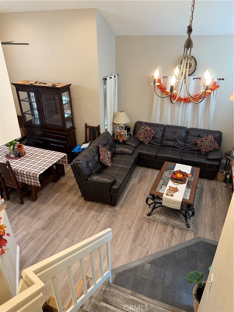 13584 Sutter Court Fontana, CA 92336 - Photo 16 of 46 a living room with furniture and a chandelier