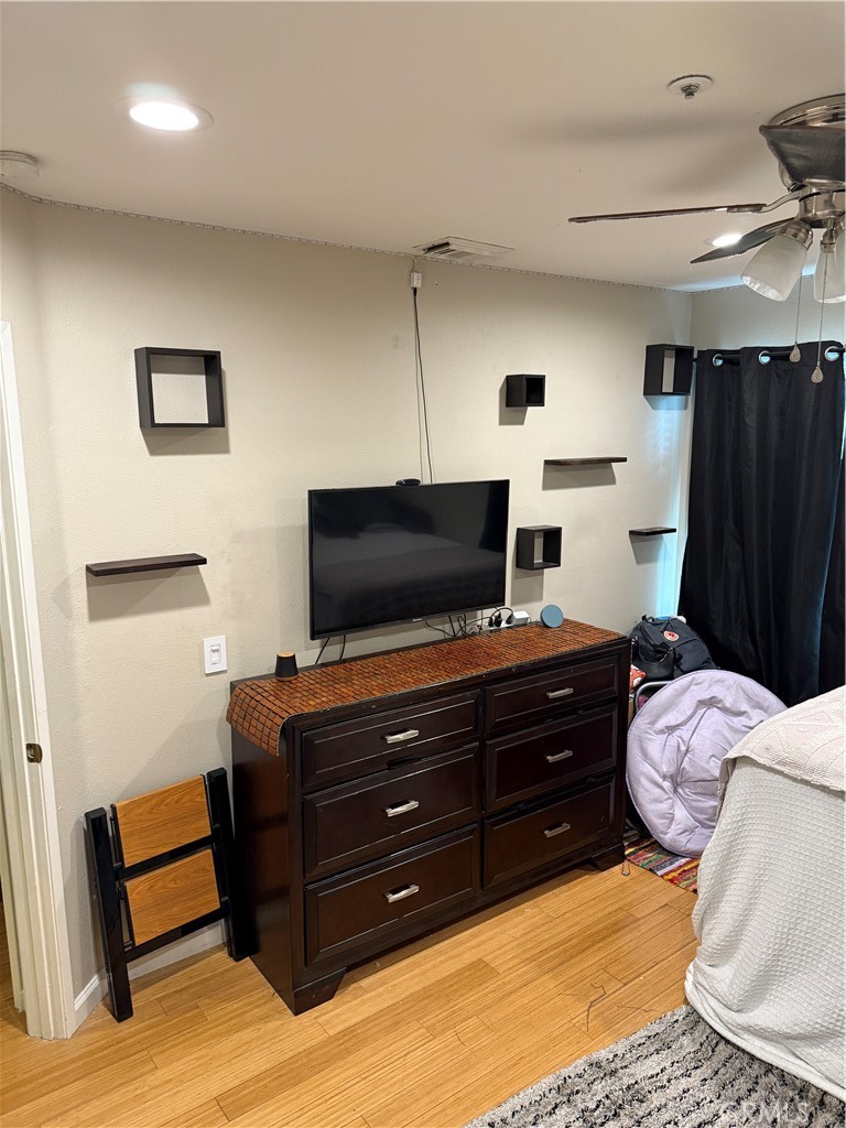 13584 Sutter Court Fontana, CA 92336 - Photo 20 of 46 a room with a bed and a television