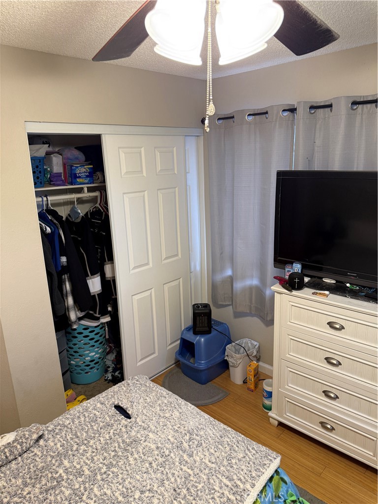 13584 Sutter Court Fontana, CA 92336 - Photo 23 of 46 a bedroom with a bed and a flat screen tv