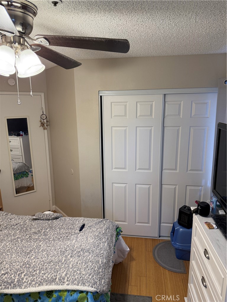 13584 Sutter Court Fontana, CA 92336 - Photo 24 of 46 a bedroom with a bed and a dresser in it