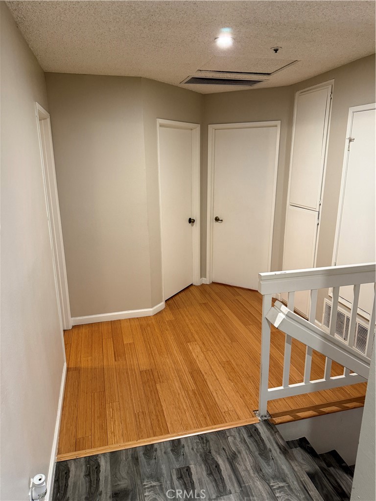 13584 Sutter Court Fontana, CA 92336 - Photo 27 of 46 a bedroom with a bed and wooden floor