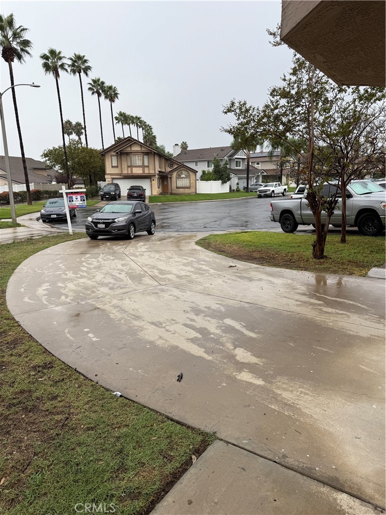 13584 Sutter Court Fontana, CA 92336 - Photo 3 of 46 a view of a street with cars