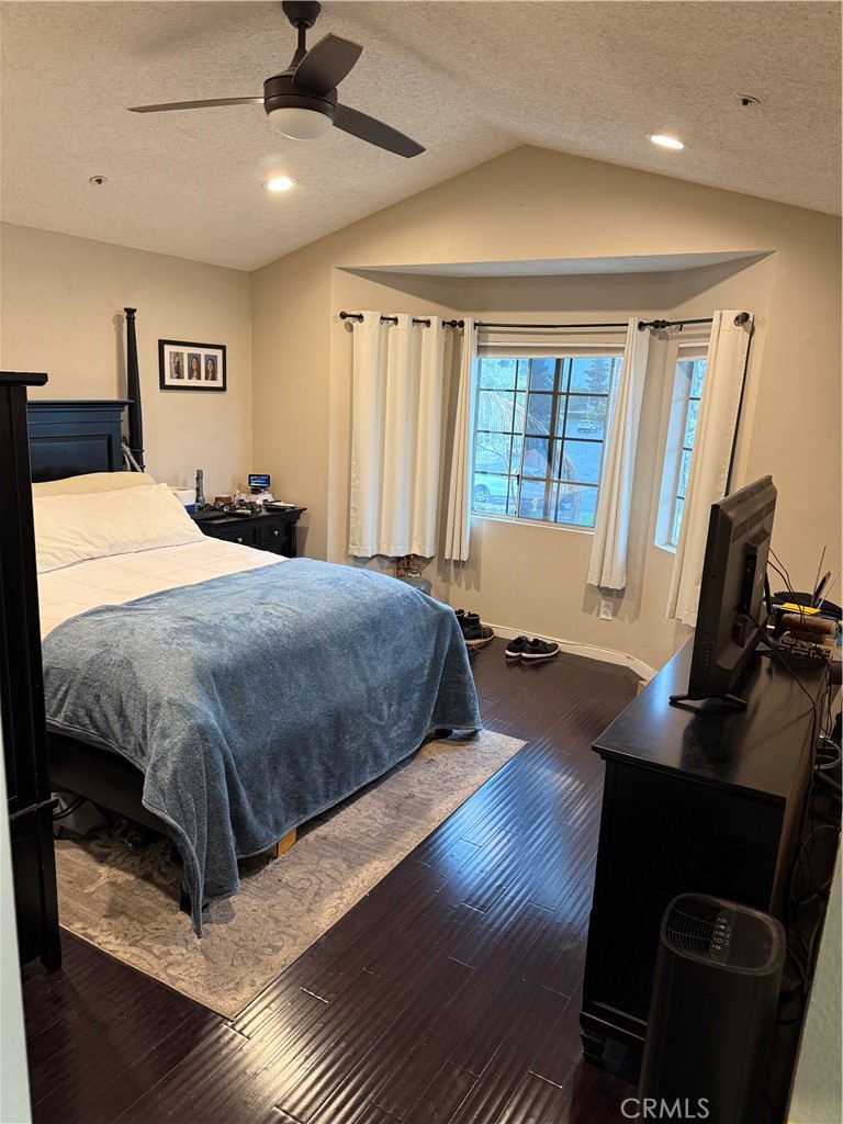 13584 Sutter Court Fontana, CA 92336 - Photo 32 of 46 a bedroom with a bed and wooden floor