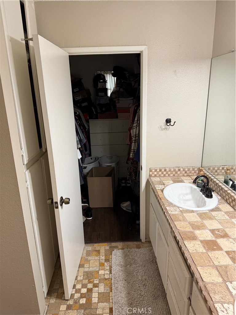 13584 Sutter Court Fontana, CA 92336 - Photo 35 of 46 a bathroom with a sink a toilet and a mirror