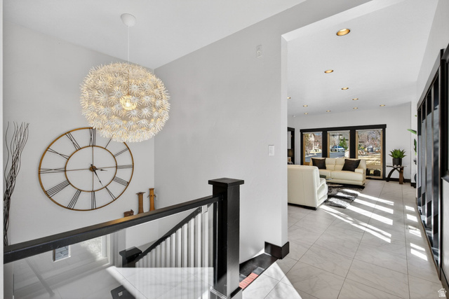 145 Carnesecca Court Mapleton, UT 84664 - Photo 21 of 109 Hallway featuring an upstairs landing and hanging lights