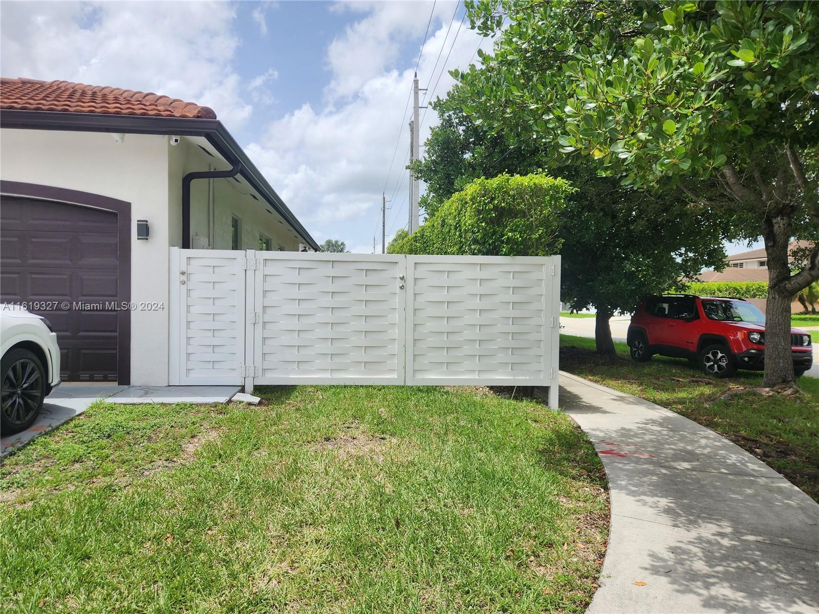 14201 Southwest 15th Street Miami, FL 33184 - Photo 12 of 37 a view of a house with a yard