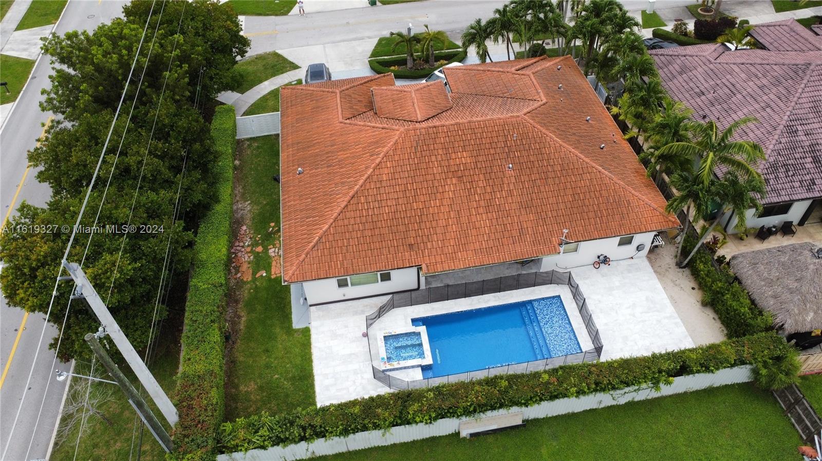 14201 Southwest 15th Street Miami, FL 33184 - Photo 13 of 37 a aerial view of a house with swimming pool and large trees