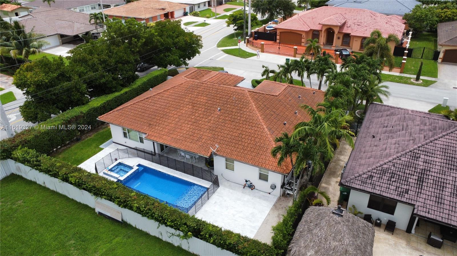 14201 Southwest 15th Street Miami, FL 33184 - Photo 14 of 37 an aerial view of a house with a yard