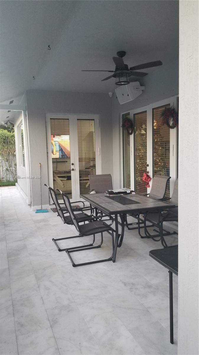 14201 Southwest 15th Street Miami, FL 33184 - Photo 19 of 37 a living room with furniture a window and a table
