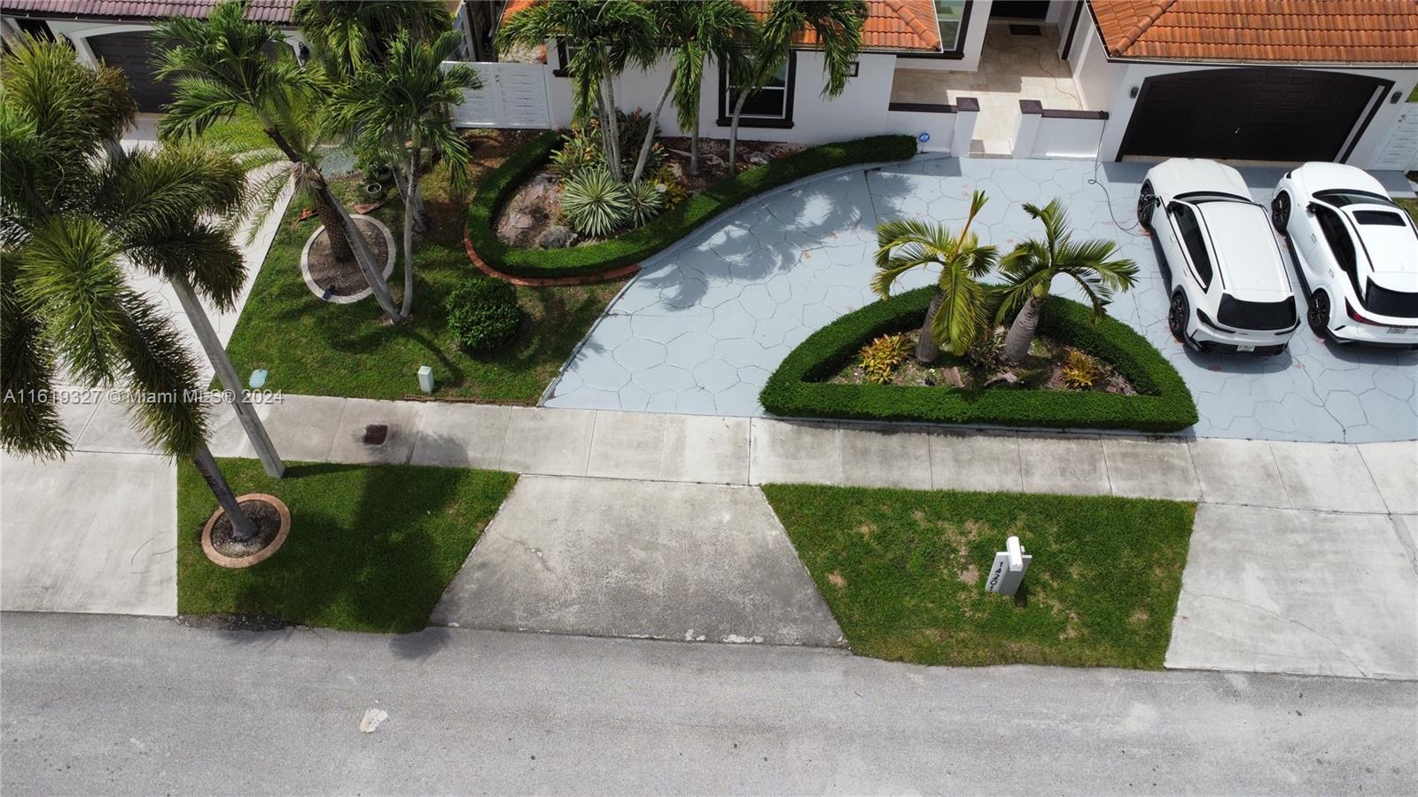 14201 Southwest 15th Street Miami, FL 33184 - Photo 28 of 37 a front view of a house with garden