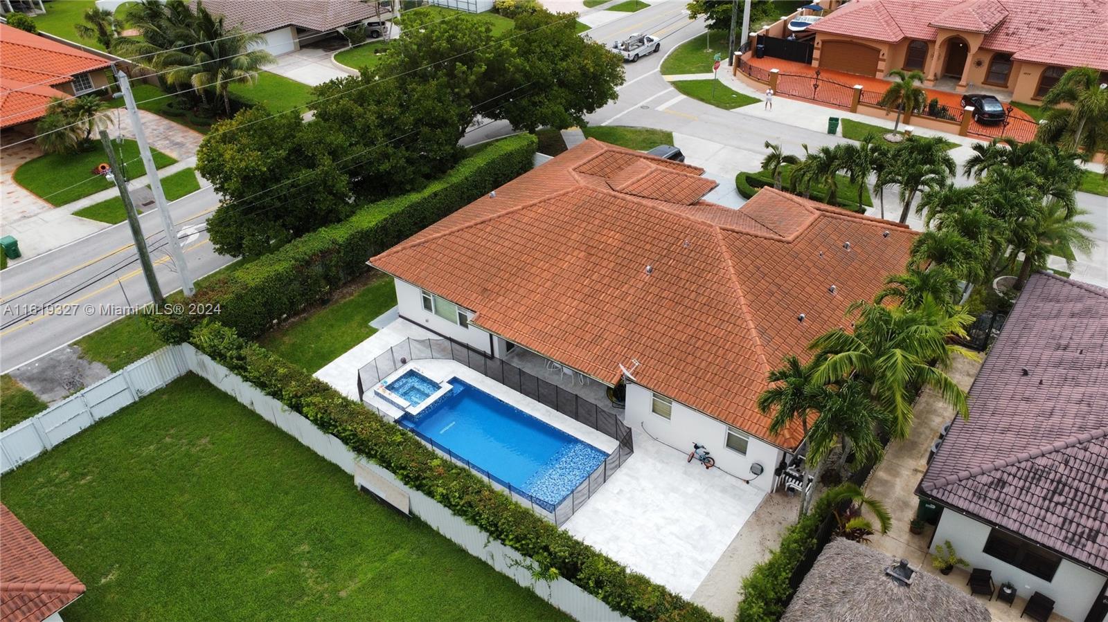 14201 Southwest 15th Street Miami, FL 33184 - Photo 33 of 37 an aerial view of a house with a garden and swimming pool