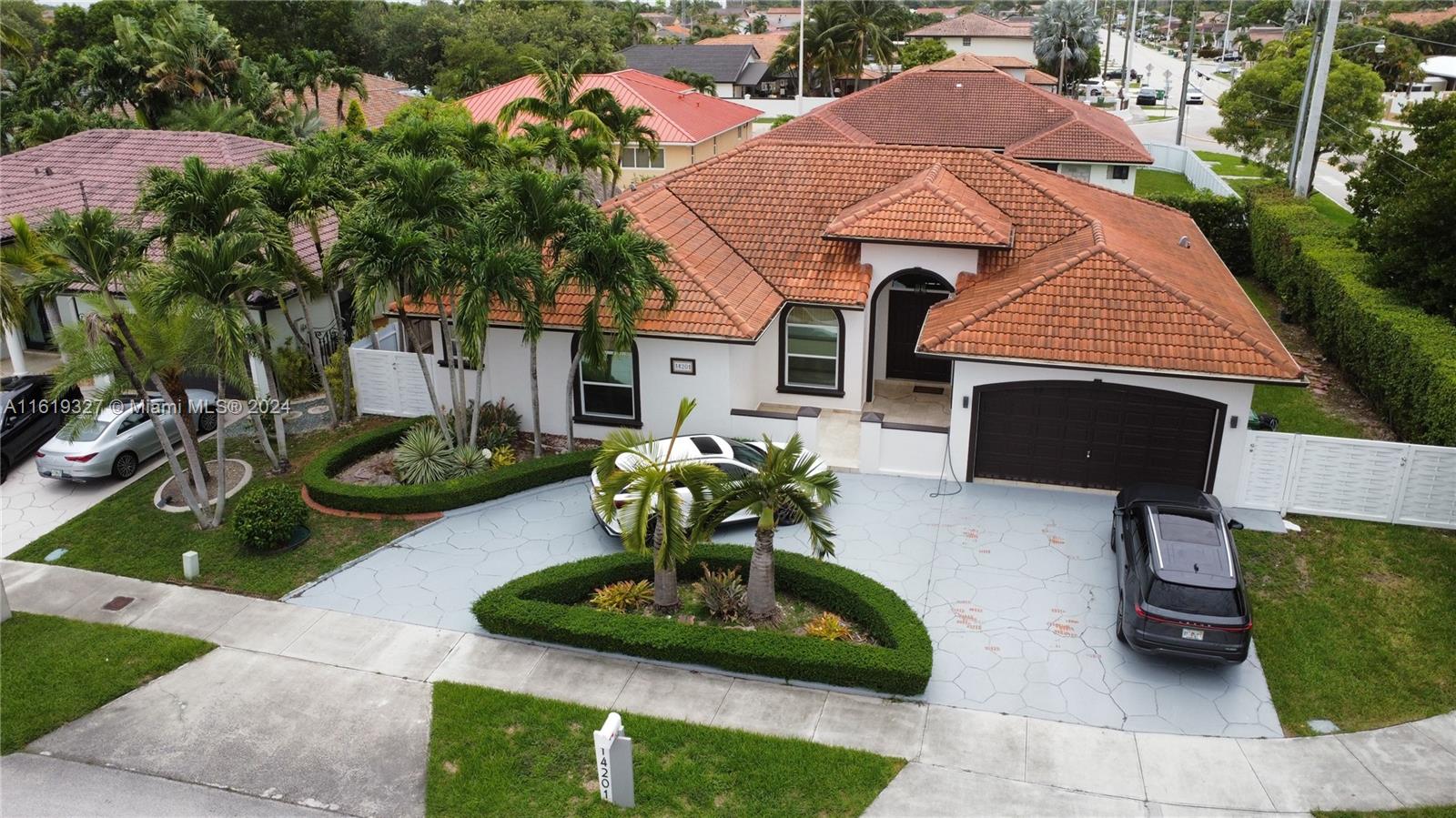 14201 Southwest 15th Street Miami, FL 33184 - Photo 4 of 37 a front view of a house with garden