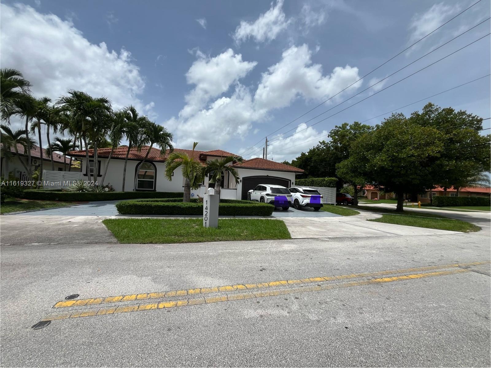 14201 Southwest 15th Street Miami, FL 33184 - Photo 5 of 37 a view of street with parked cars